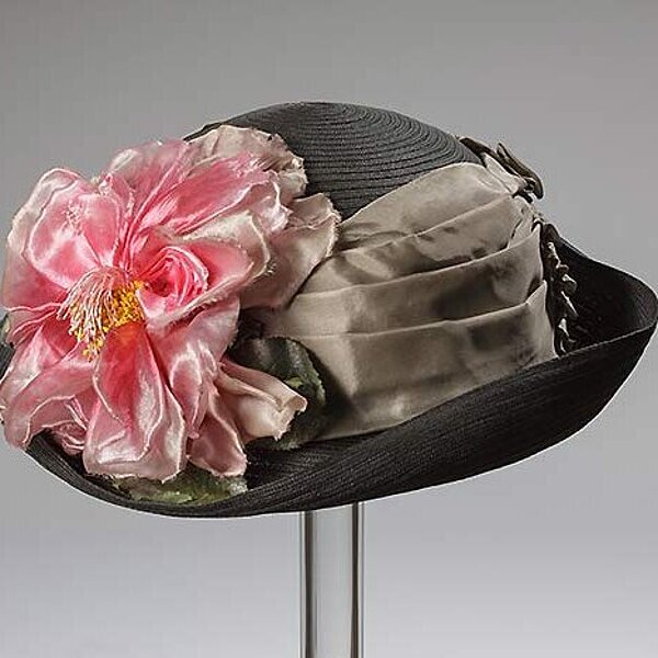 Ladies hat made of hard fibre braid with silk and fabric blossom